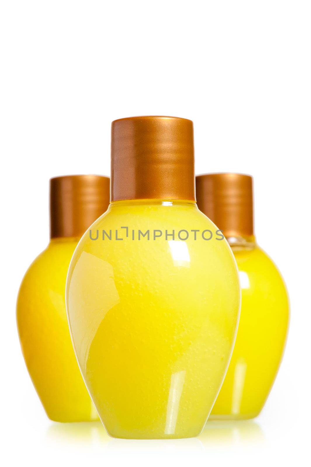 yellow bottles with cosmetics on the white background