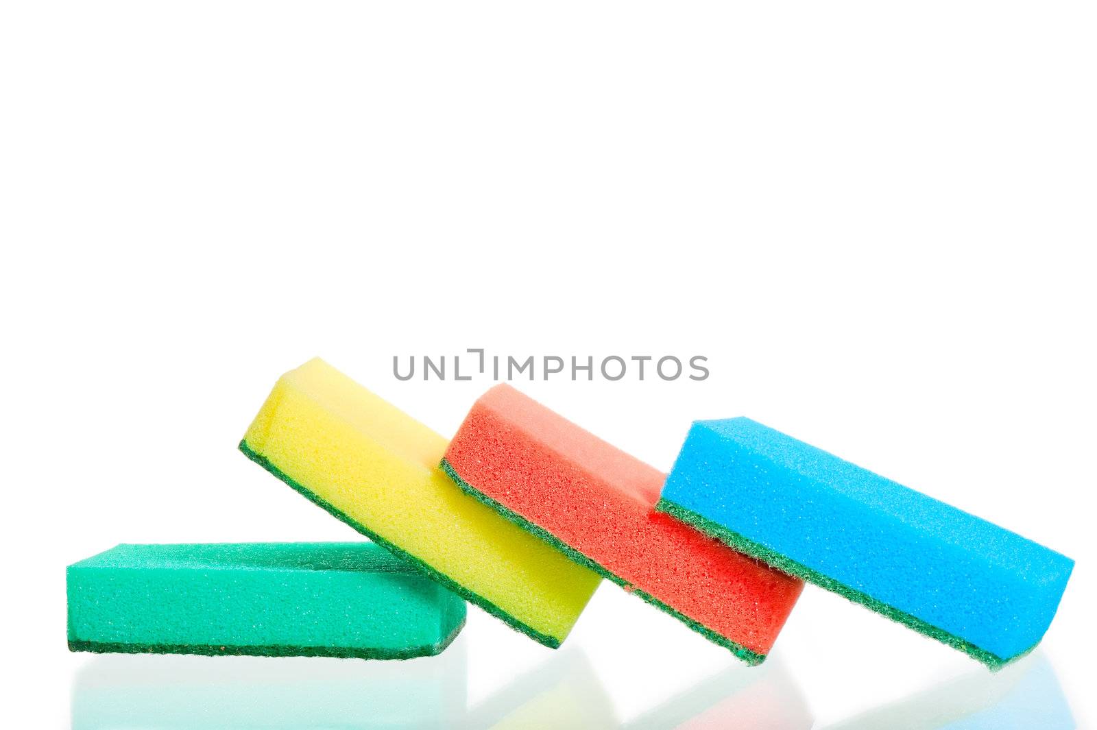 Four multi-colored sponges on white background by kosmsos111