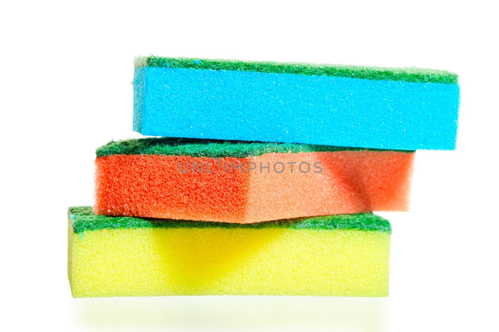 a stack of colorful sponges for ware on a white background by kosmsos111