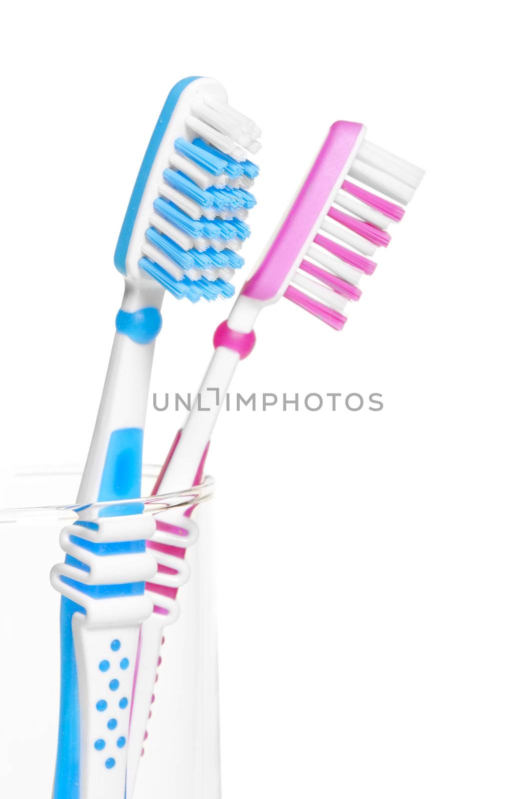 pink and blue brush stand in a glass by kosmsos111