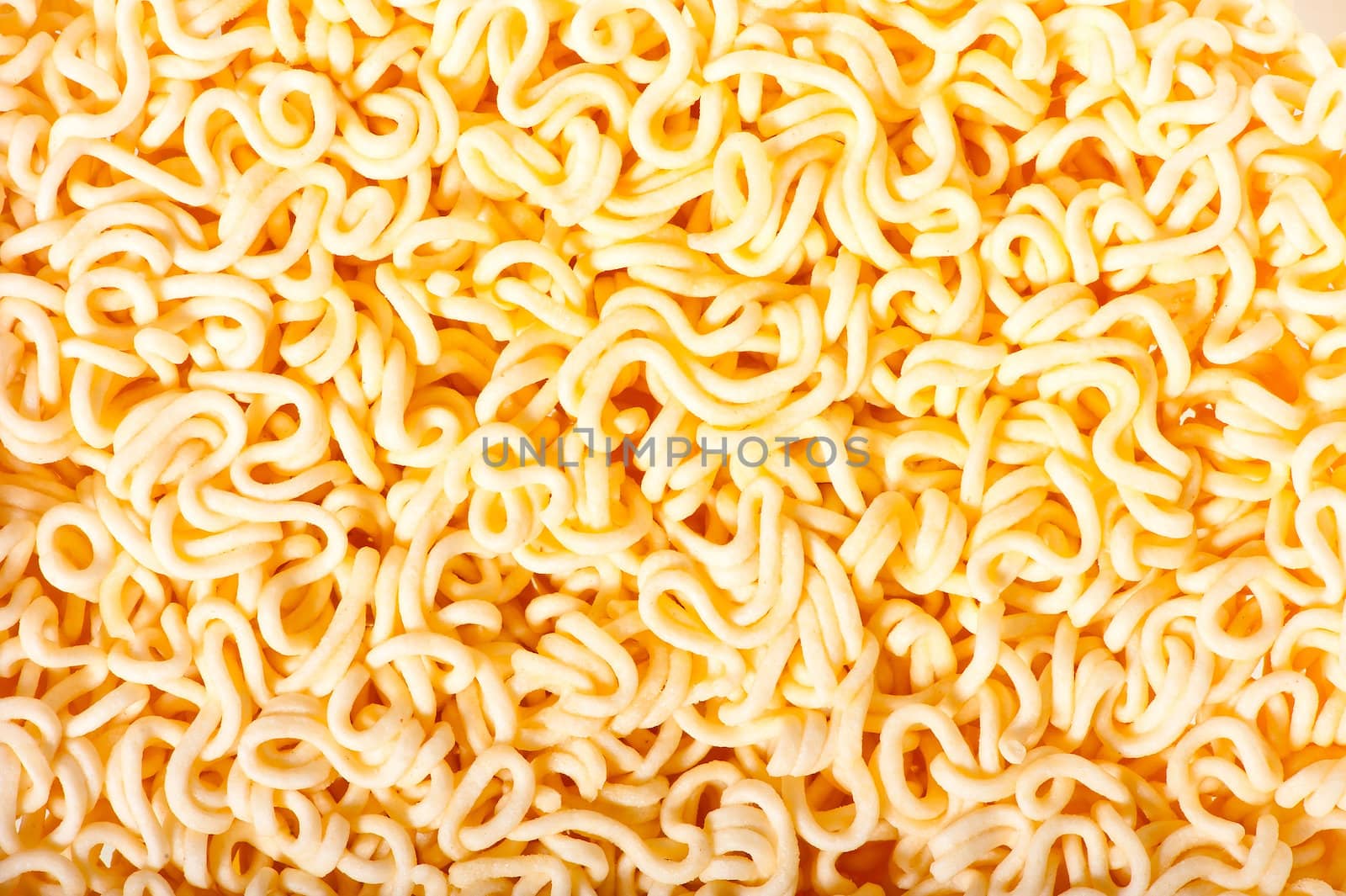 yellow dry noodles - background close-up by kosmsos111