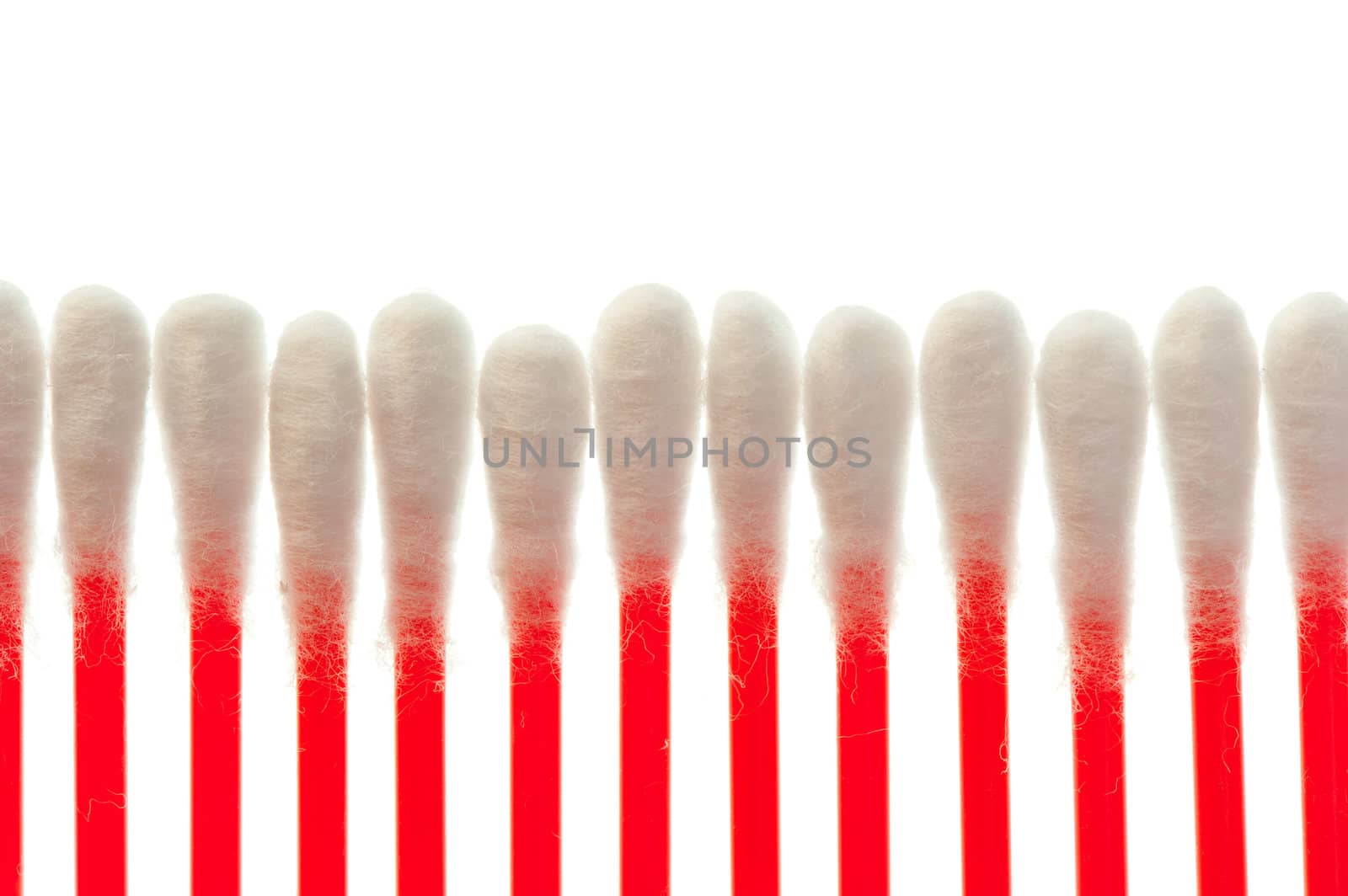 pure cotton buds lined up in a row by kosmsos111