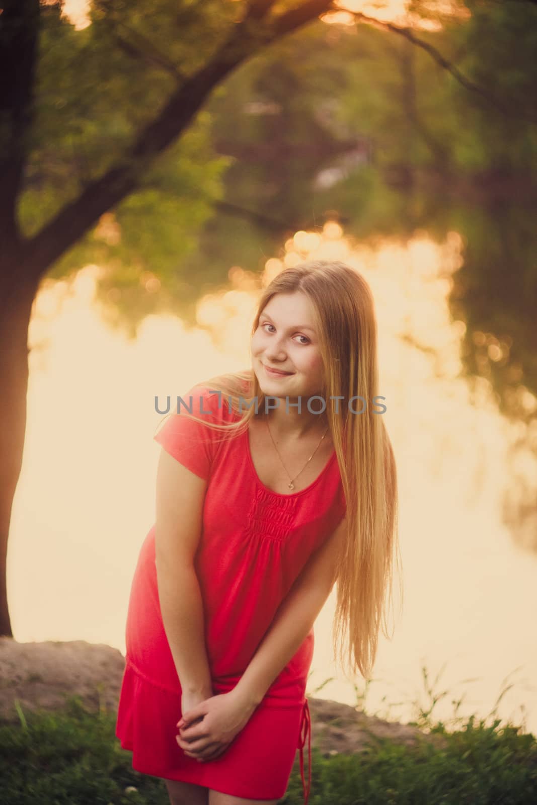Beautiful Young Girl Standing On Park by ryhor