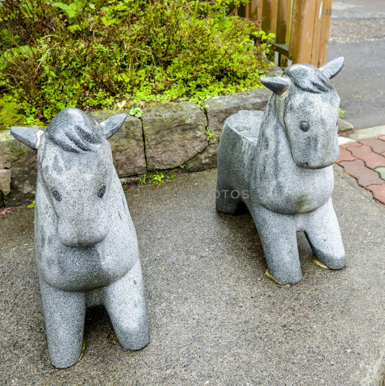 Twin stone pony statue by gjeerawut