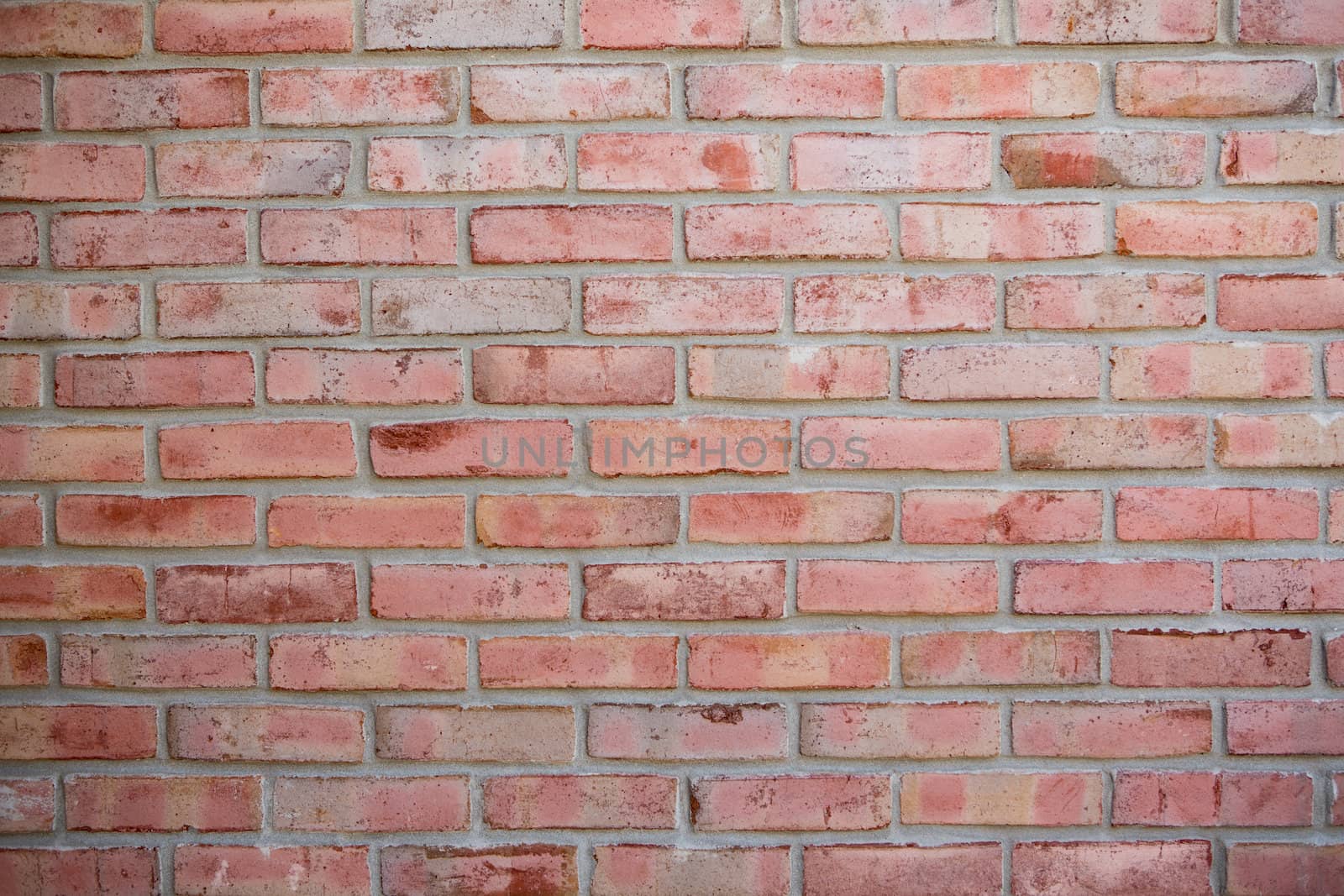 Newly built red brick wall background, bricks have some old look but not much