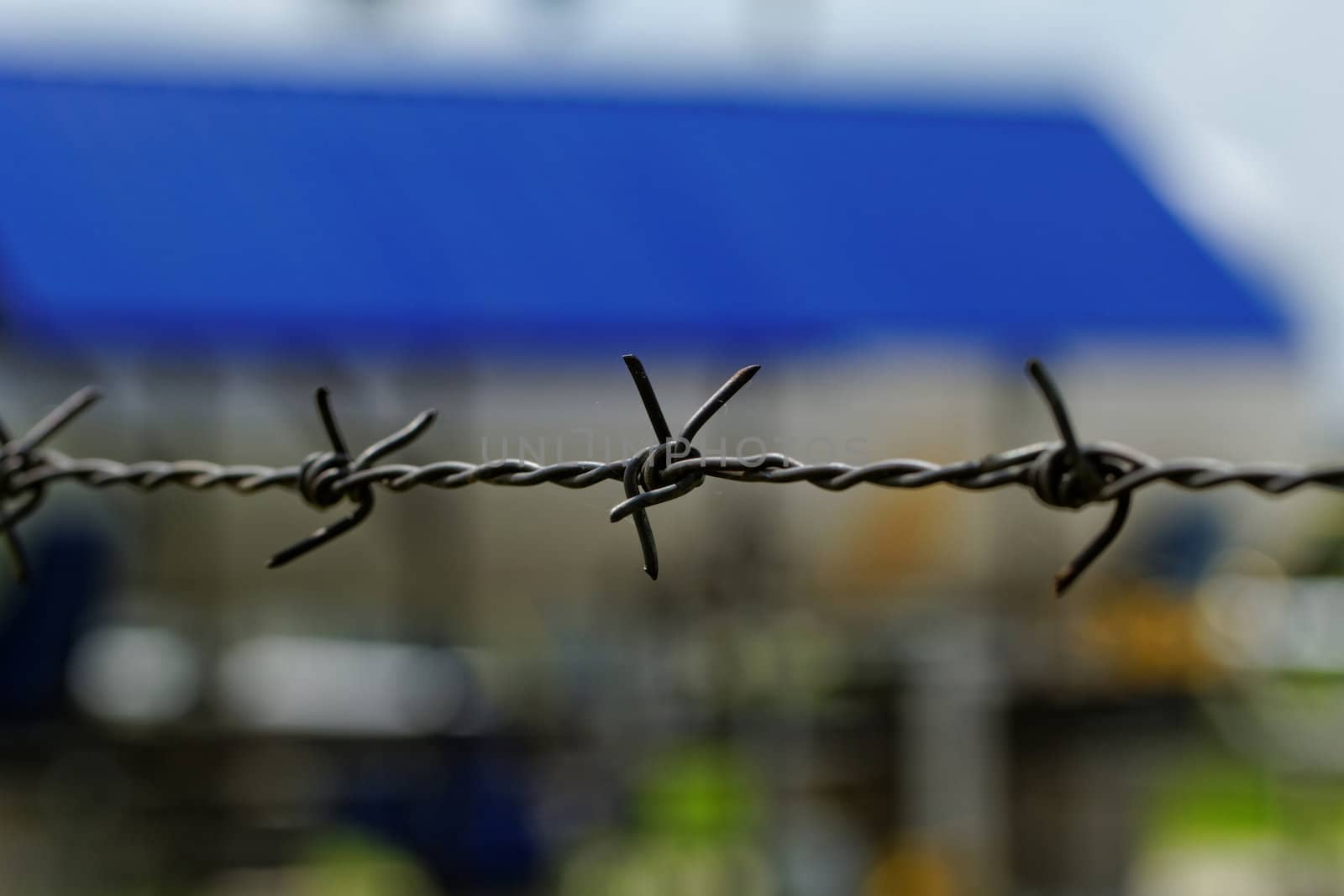barbed wire defending the industries