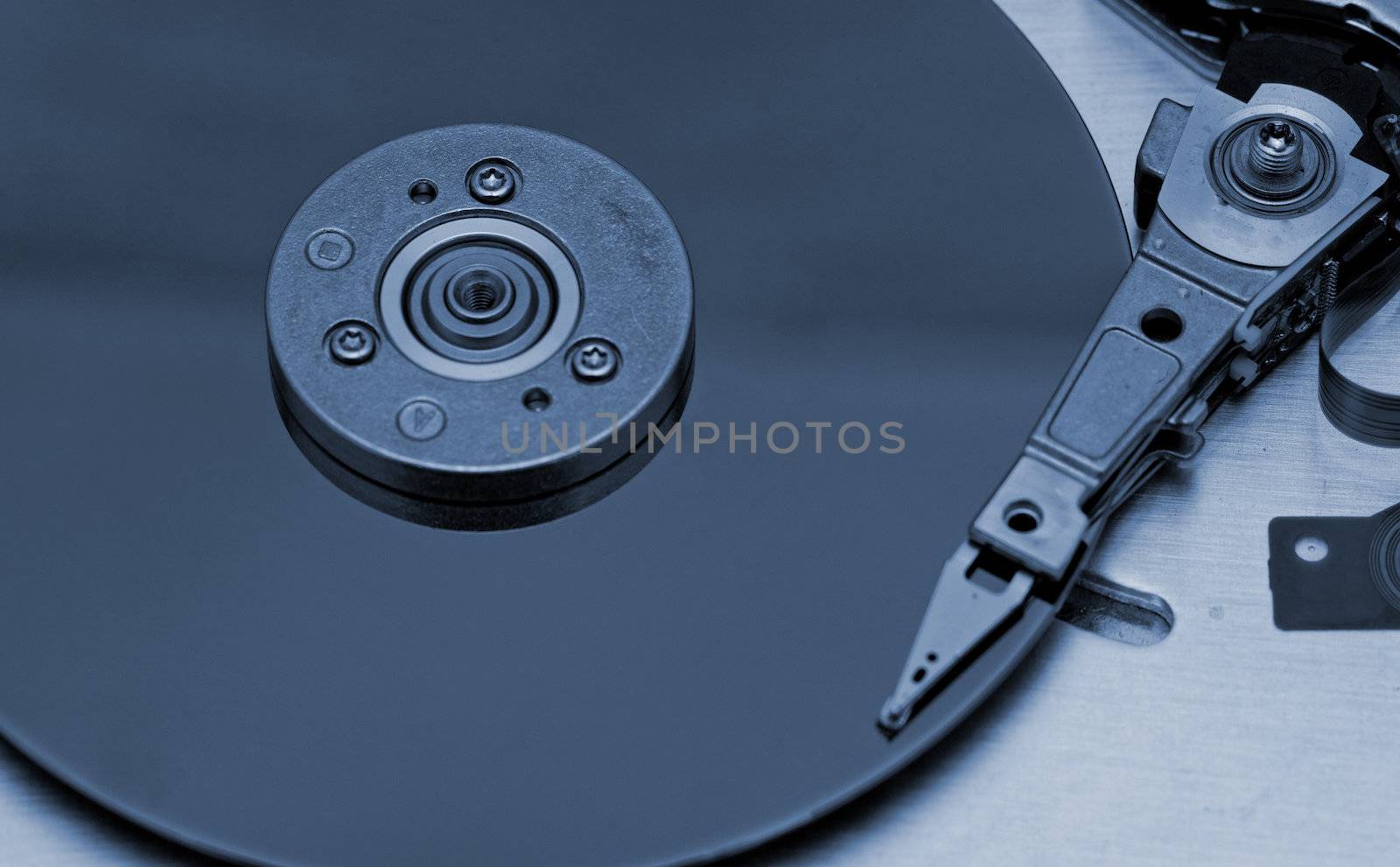 Open computer hard drive on white background by NagyDodo