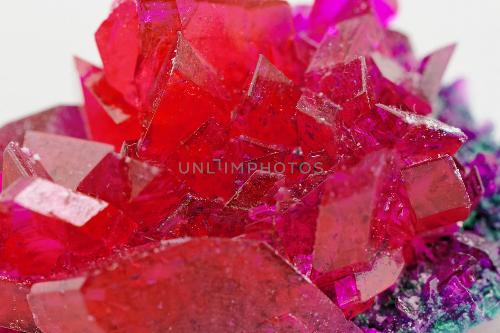 close up of crystals in ruby color on white background (red crystal)