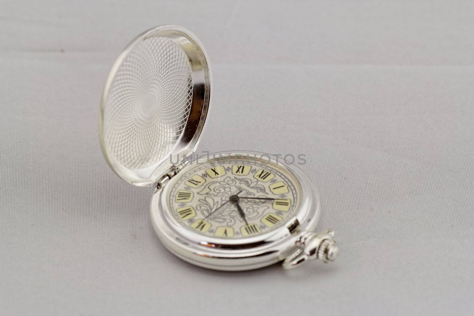 old pocket watch on white background by NagyDodo