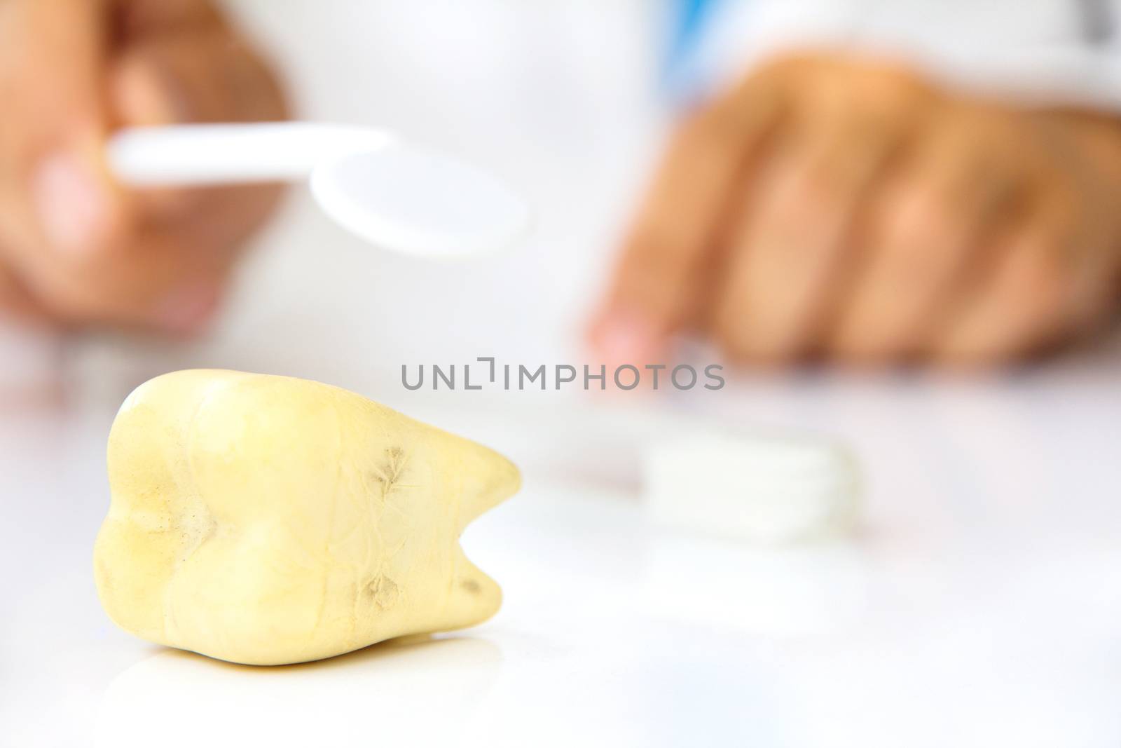 molar with dentist background, dental hygiene concept