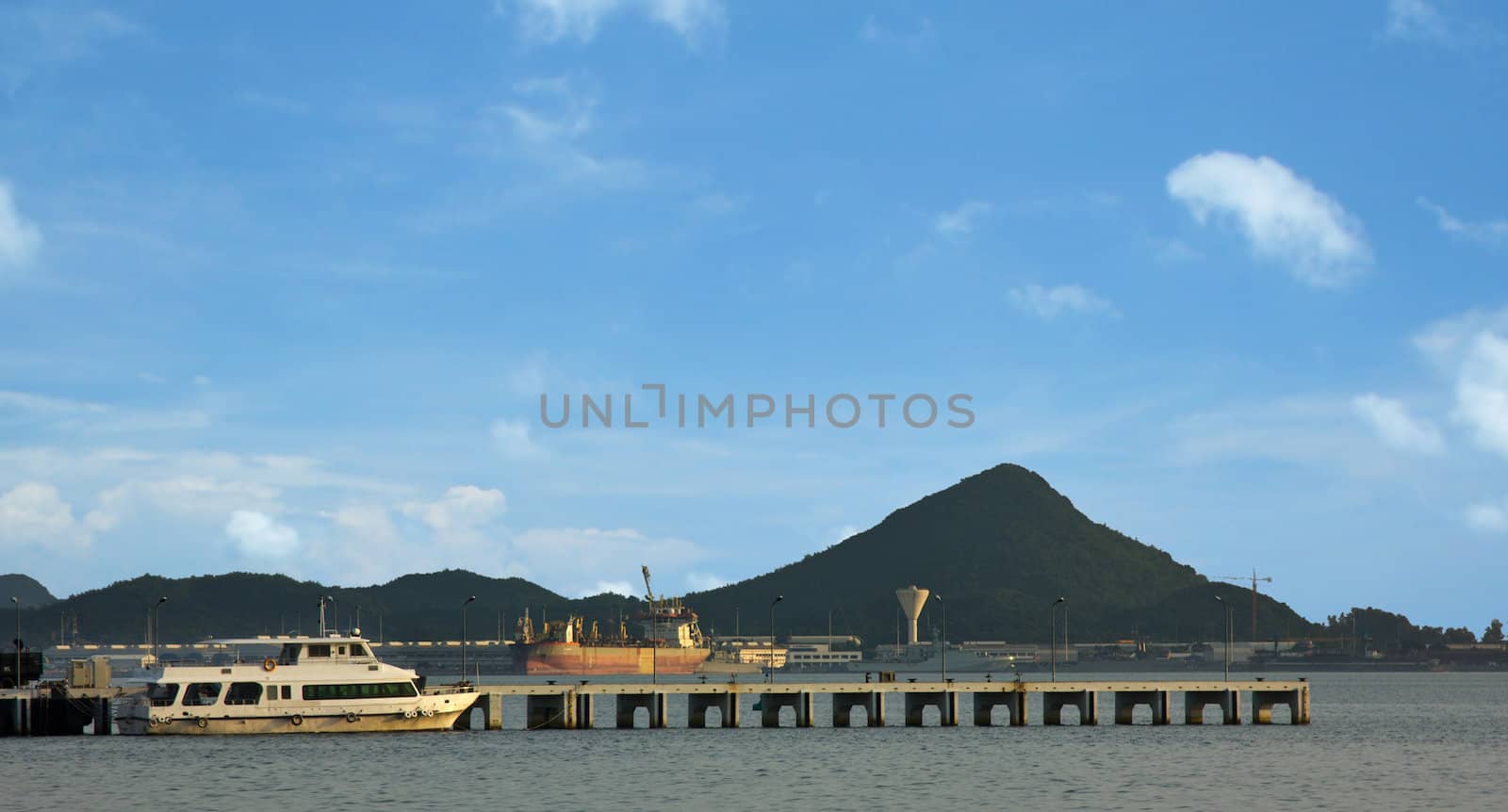 Ship in industrial port and sky landscape