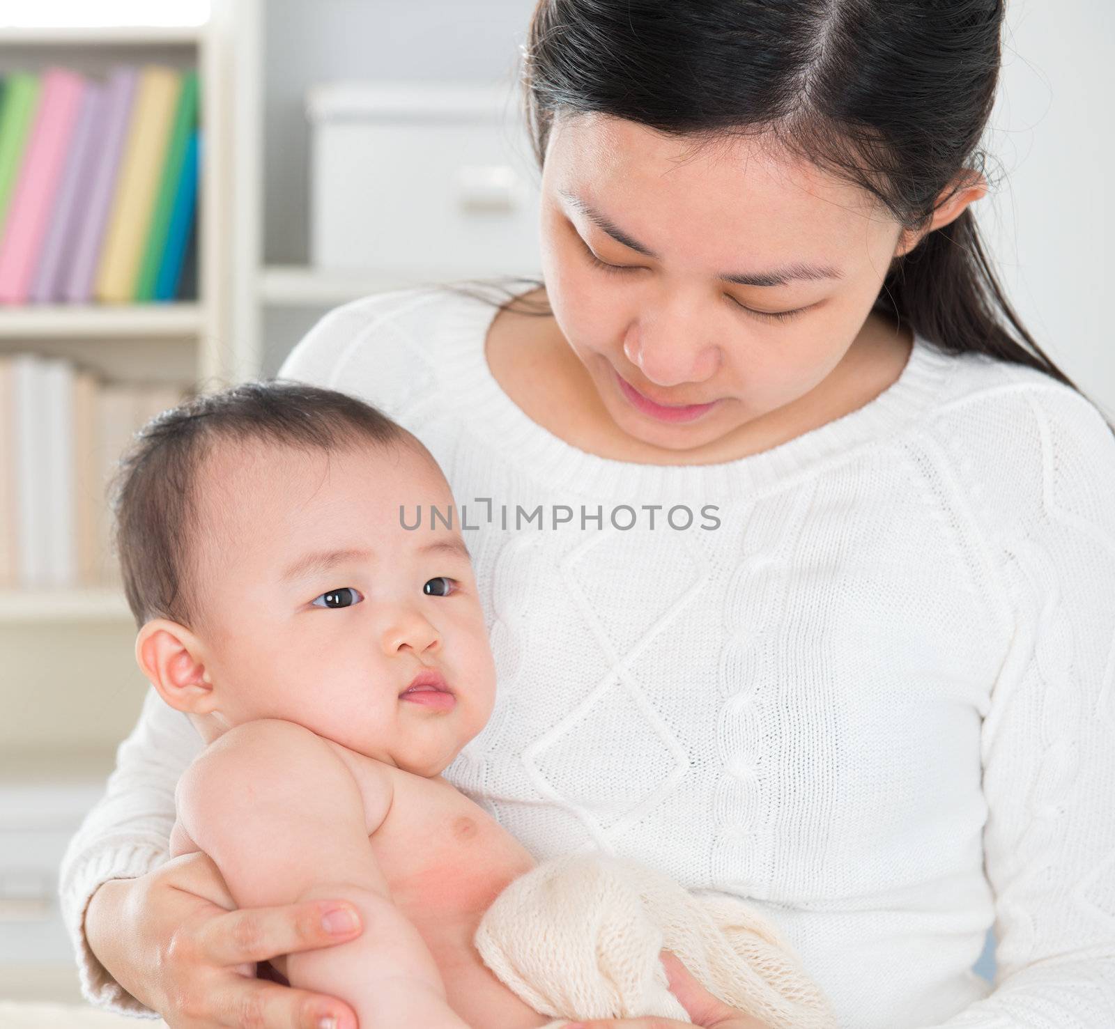 Asian mother pampering baby girl by szefei