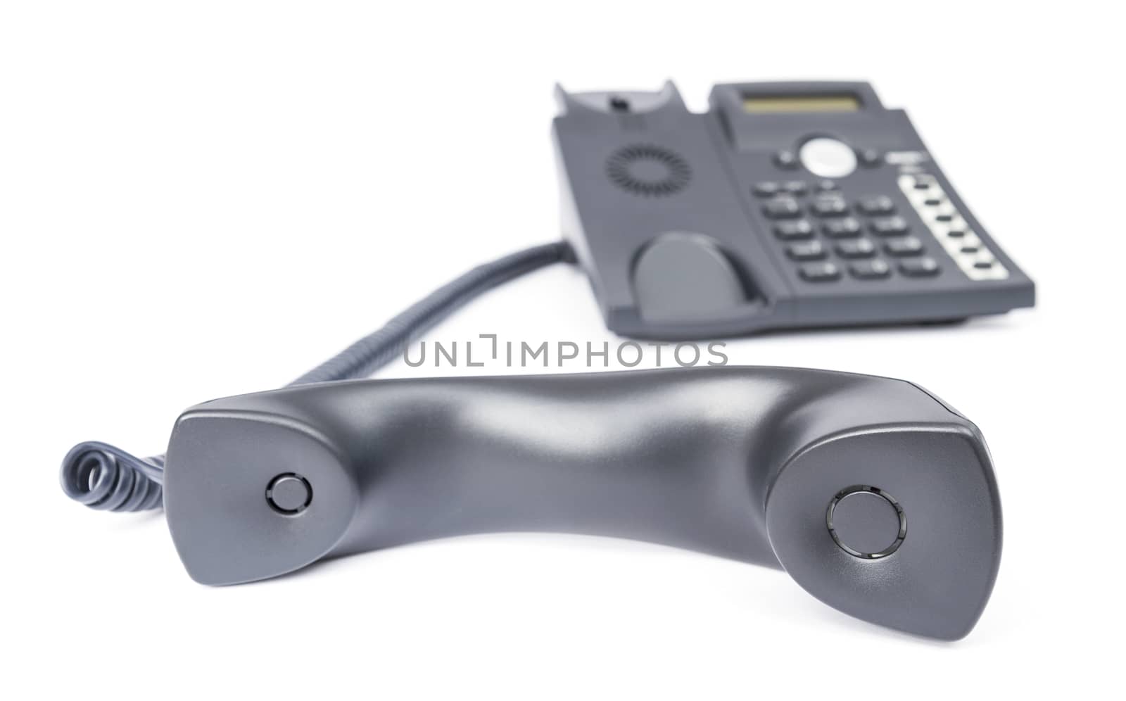 telephone receiver with blurred phone in background