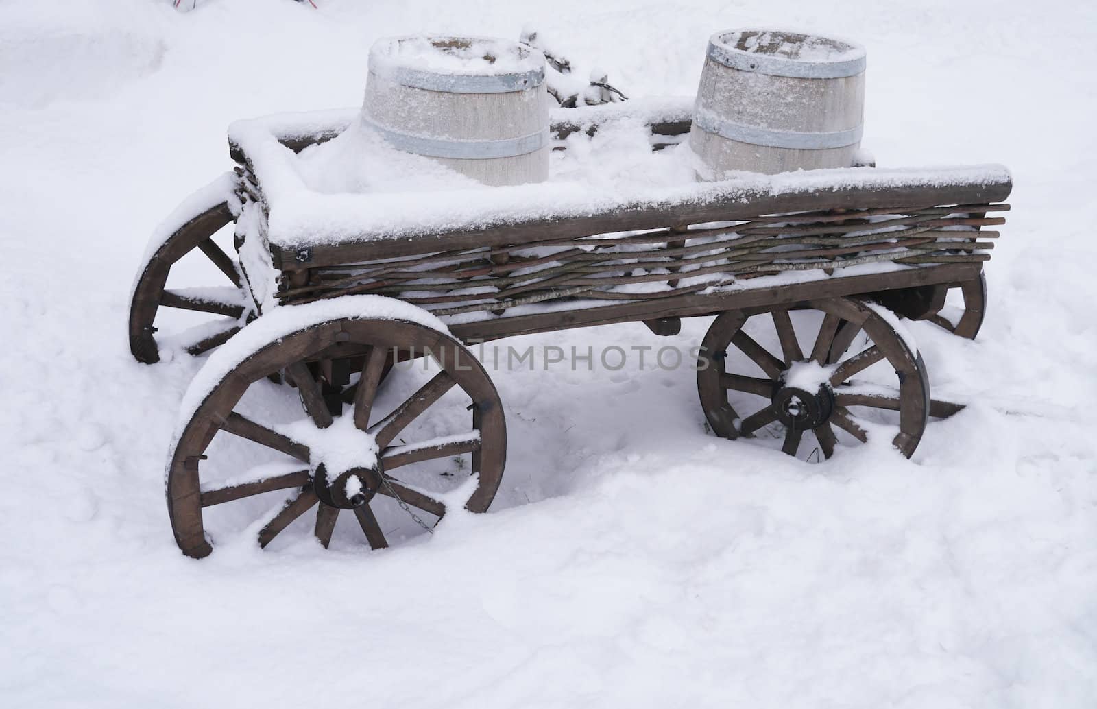dray horse with barrels in the snow