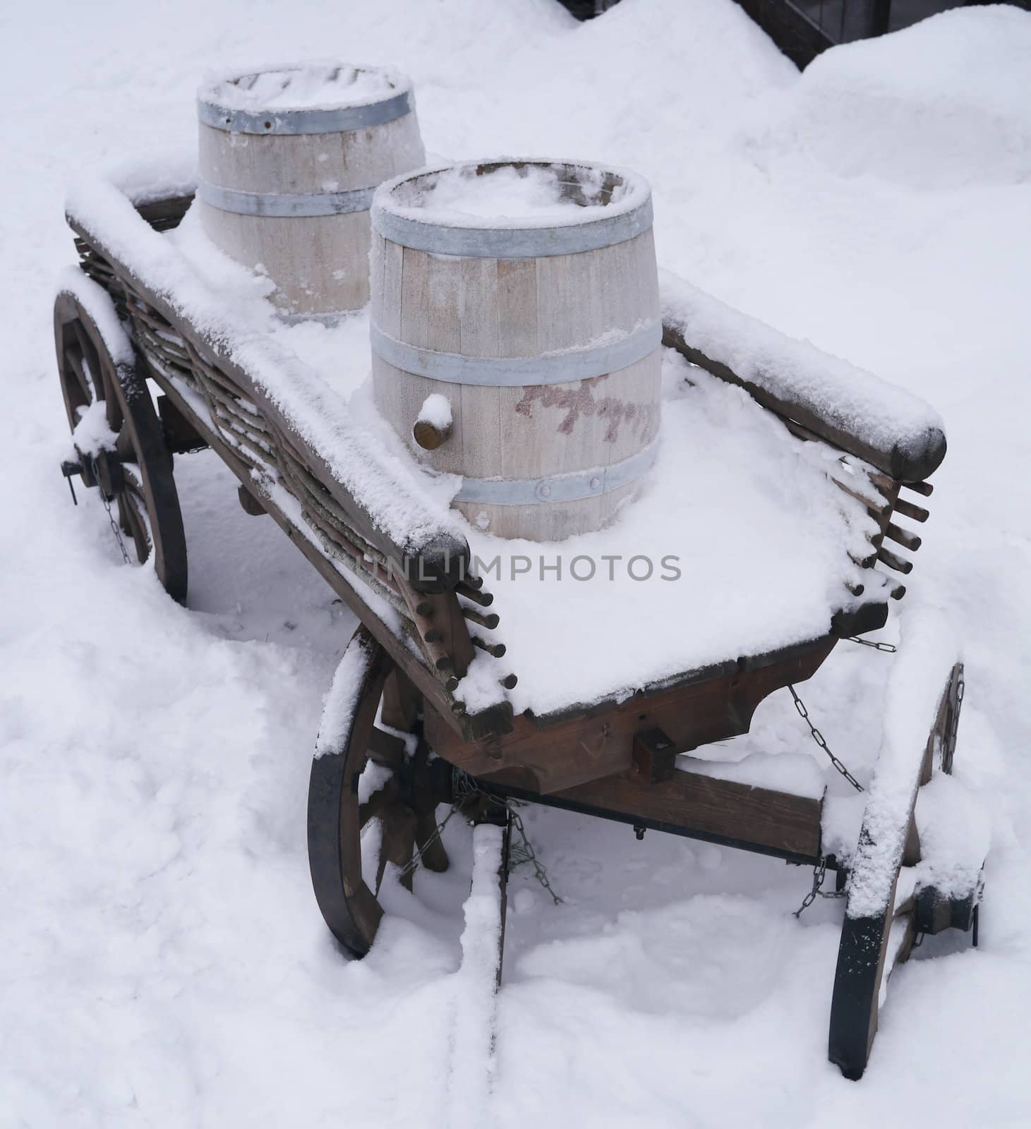 dray horse with barrels in the snow
