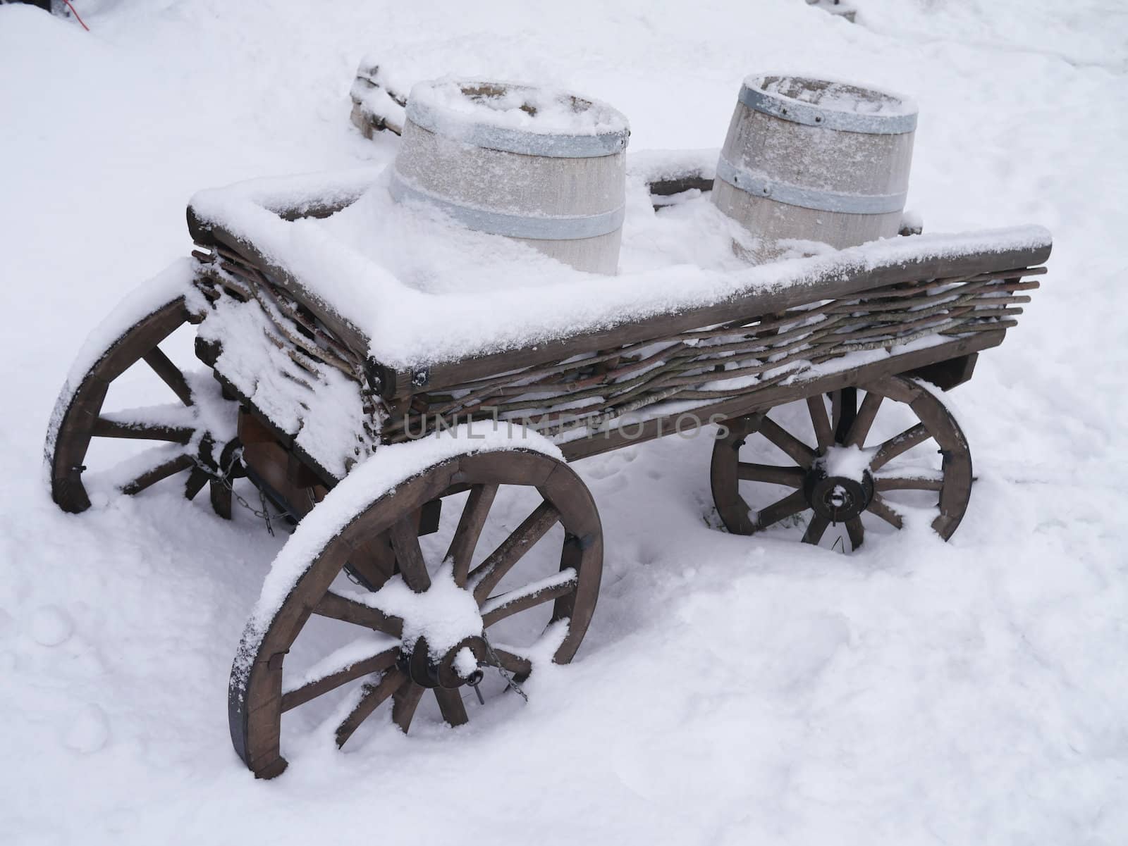 dray horse with barrels in the snow