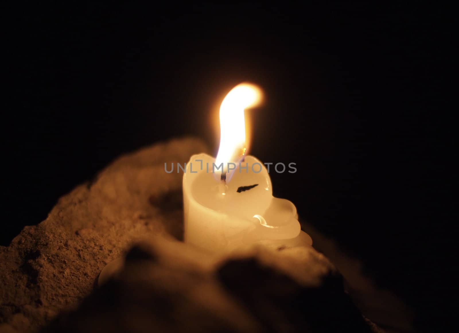 candle on the stone  by Enskanto