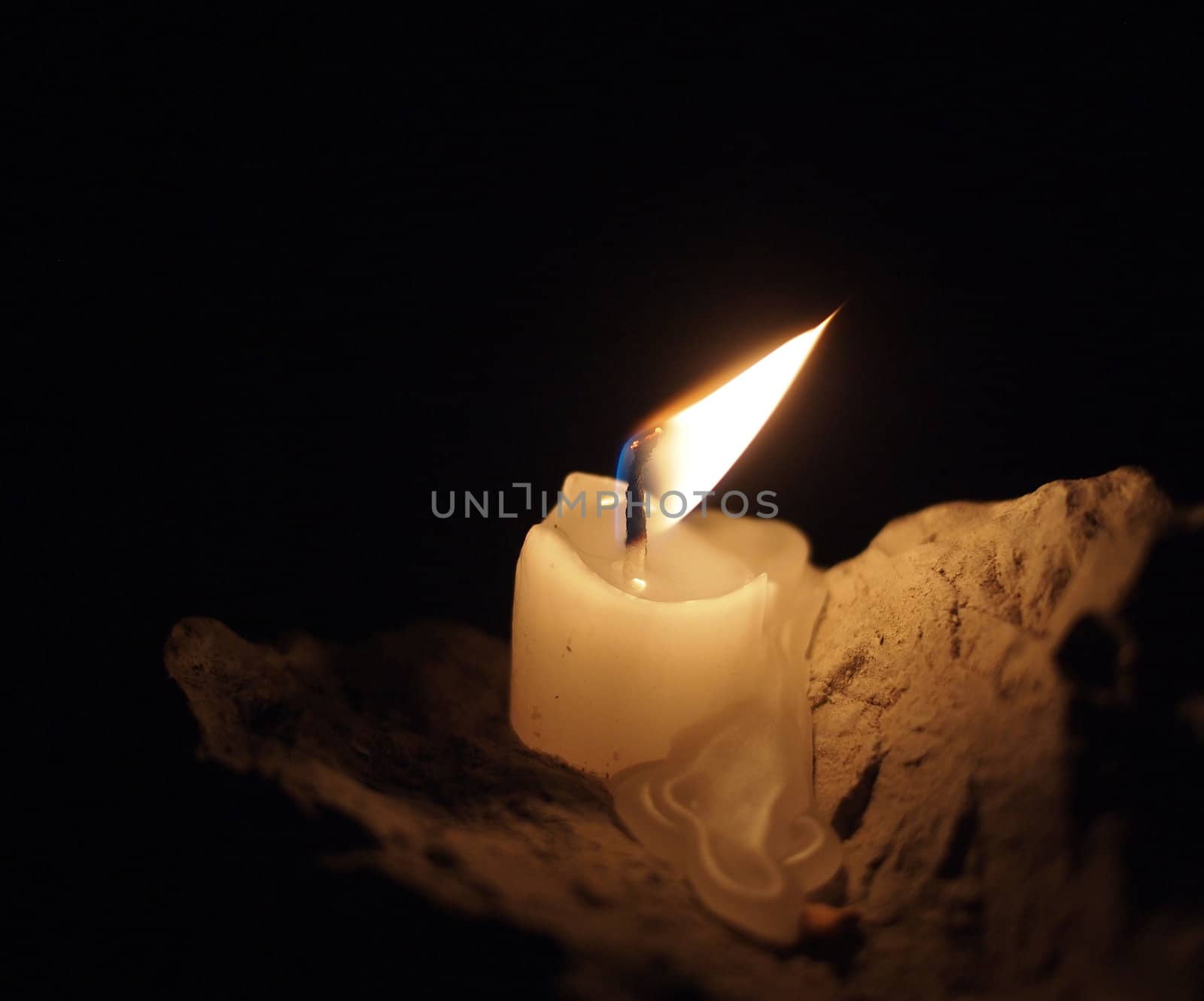 candle on the stone  by Enskanto