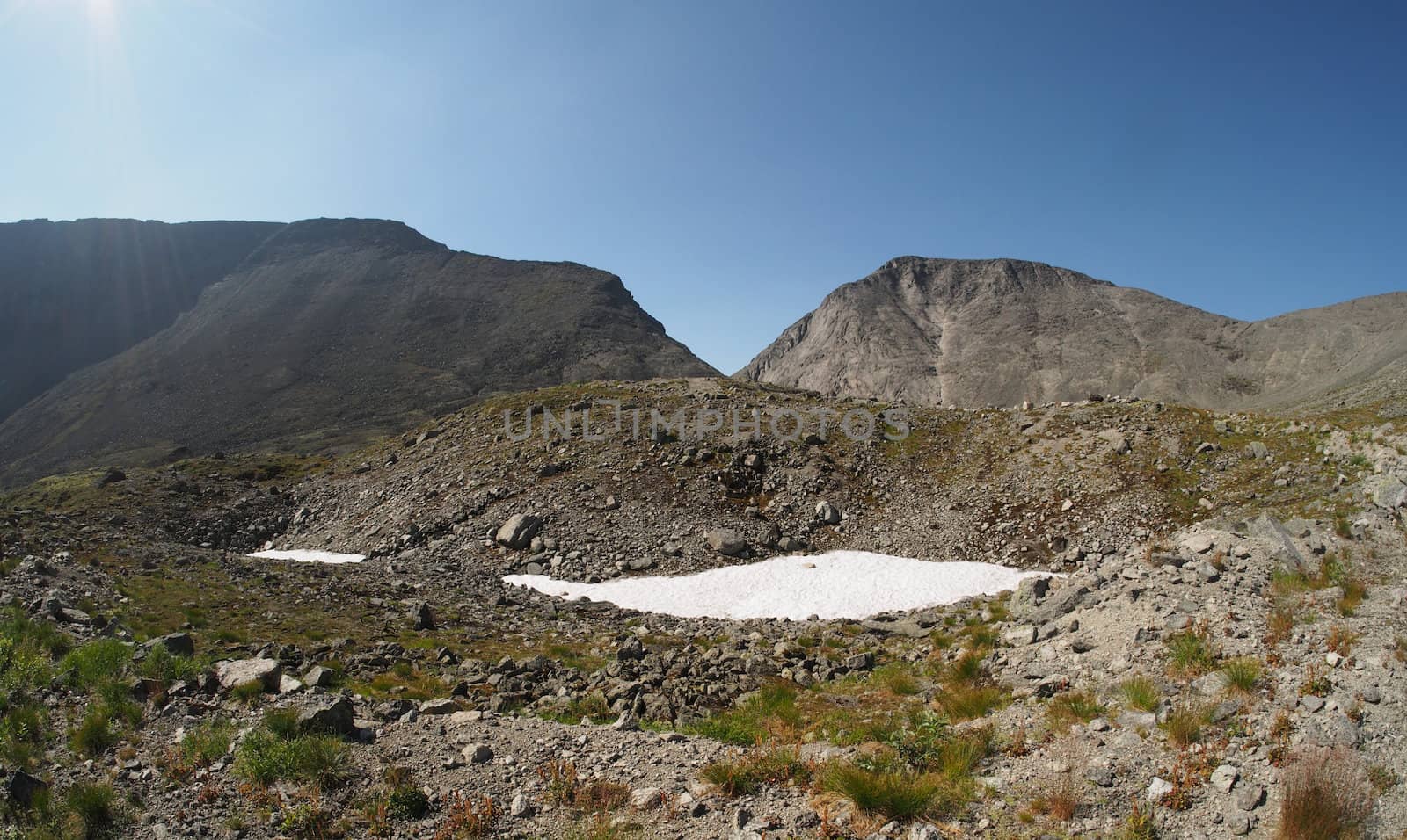 Snow in the mountains in summer
