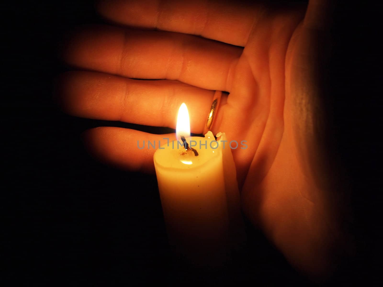 hand with candle