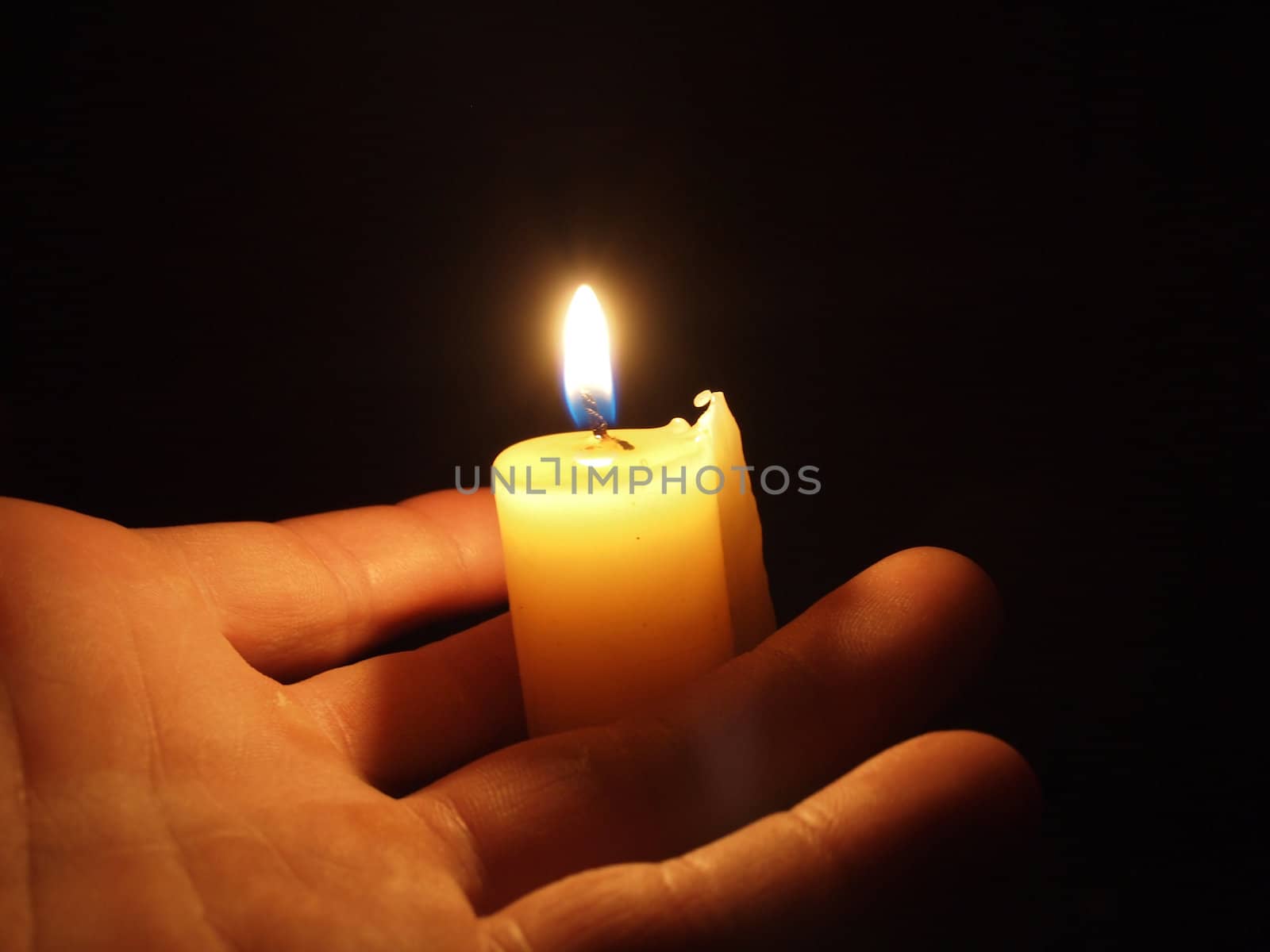 hand with candle