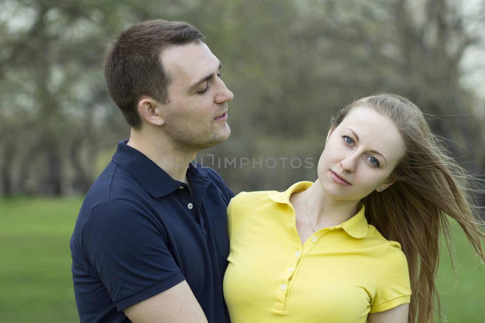 Portrait of love couple embracing outdoor