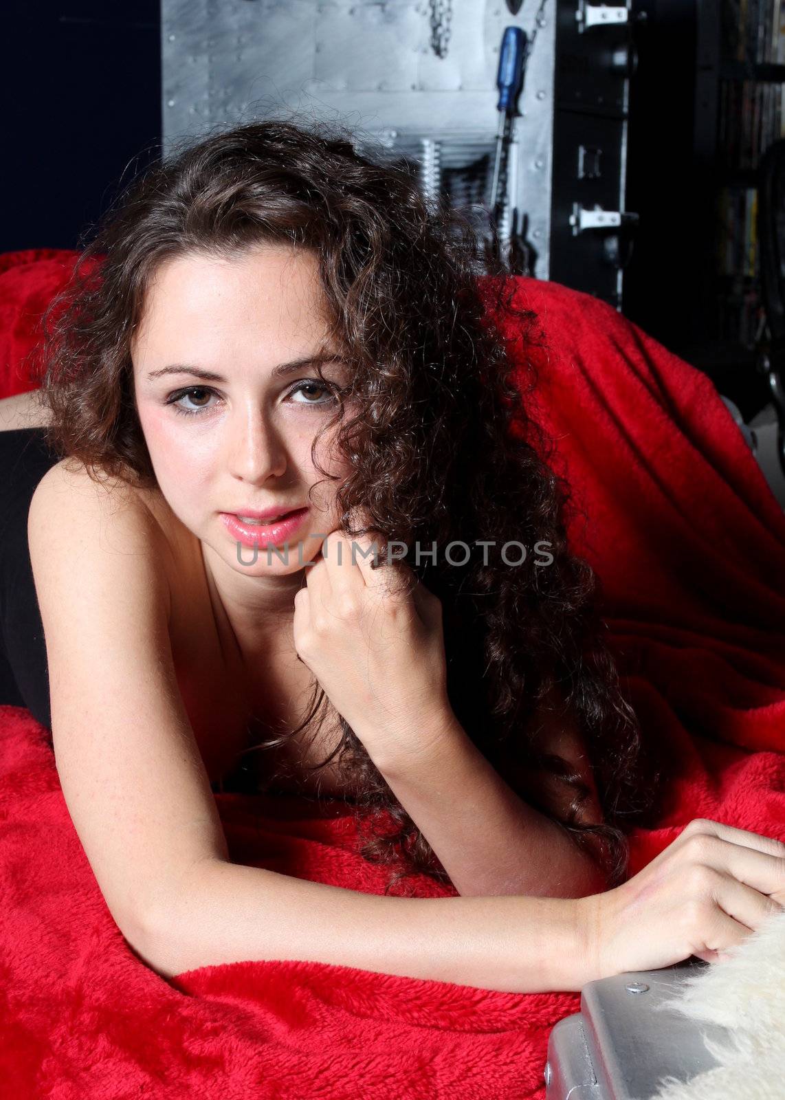 Portrait of a brunette woman on red.