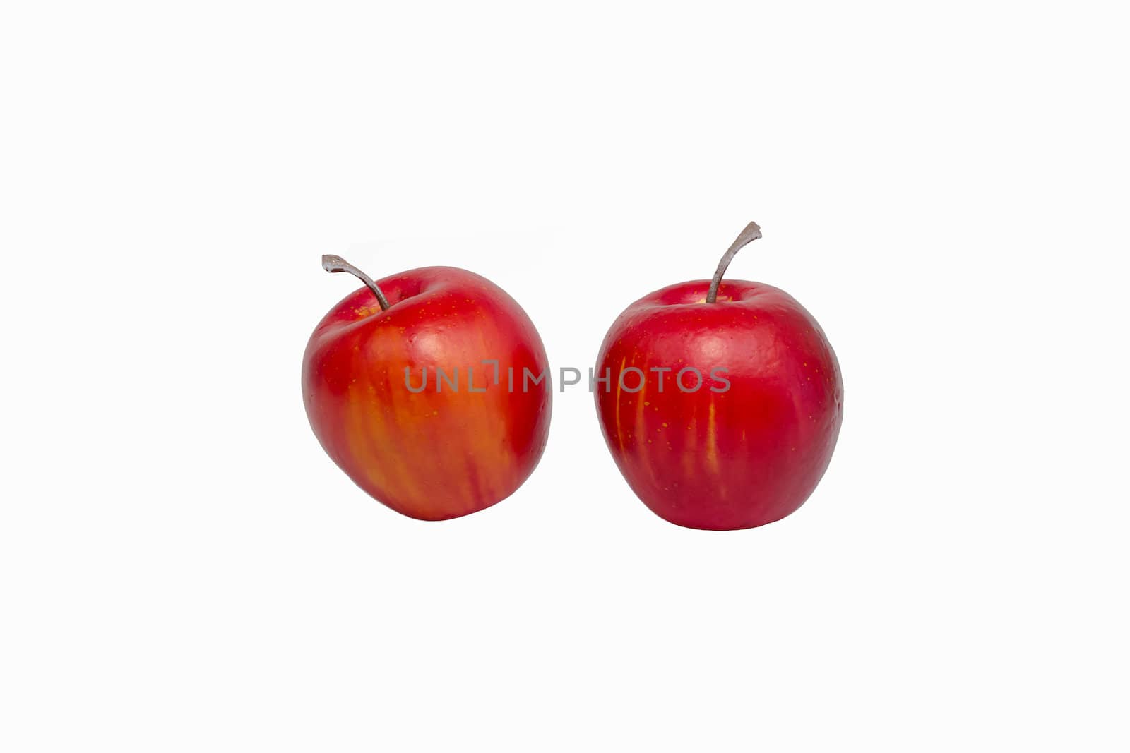 Two red apples are arranged side by side in full focus.