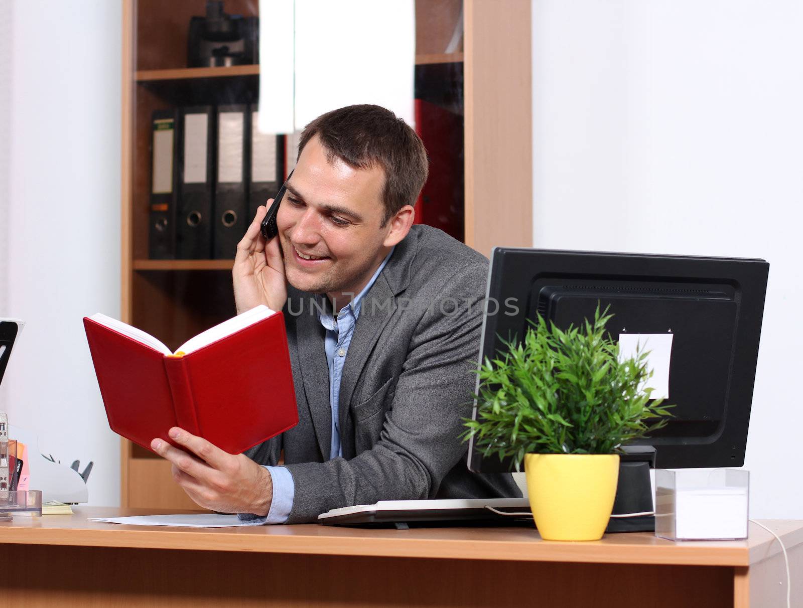 Smiling man talking on mobile phone