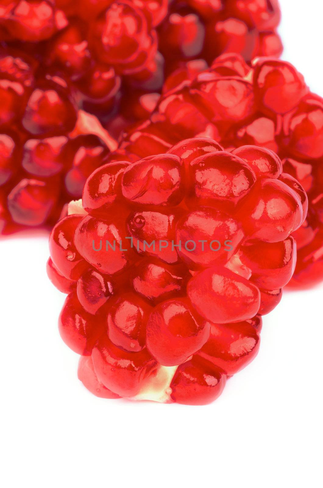 Perfect Ripe Pieces of Pomegranate isolated on white background