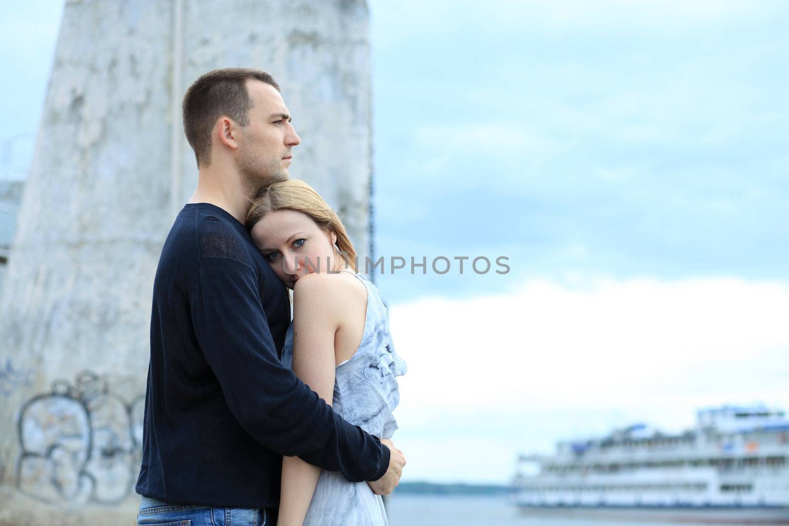 loving couple says goodbye to the river station