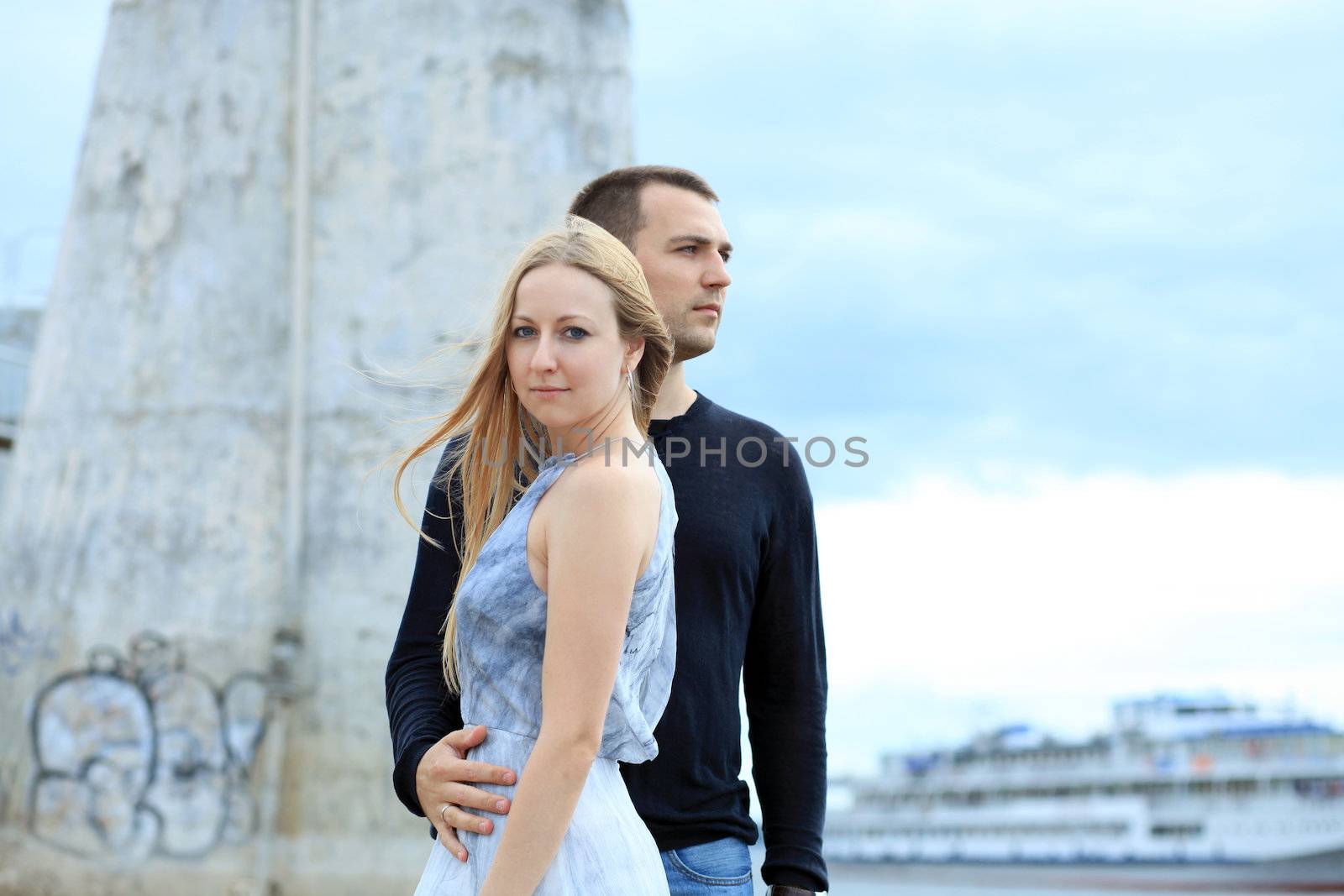 loving couple says goodbye to the river station