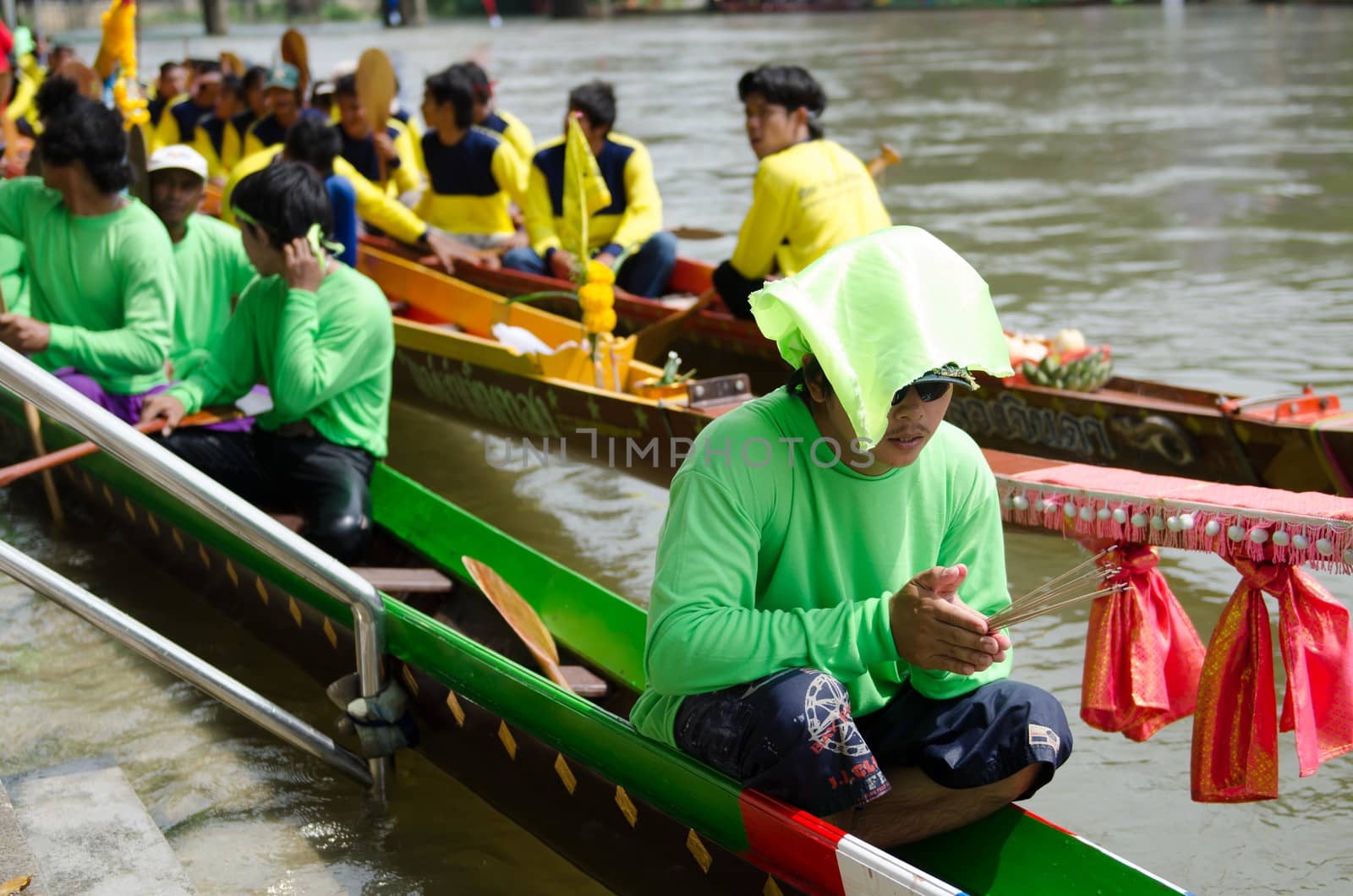 Petchaburi, THAILAND - October 7 : Participants in the Petchaburi Long Boat Competition 2012 on October 7, 2012 in The Petchaburi river ,Petchaburi Province, Thailand. 