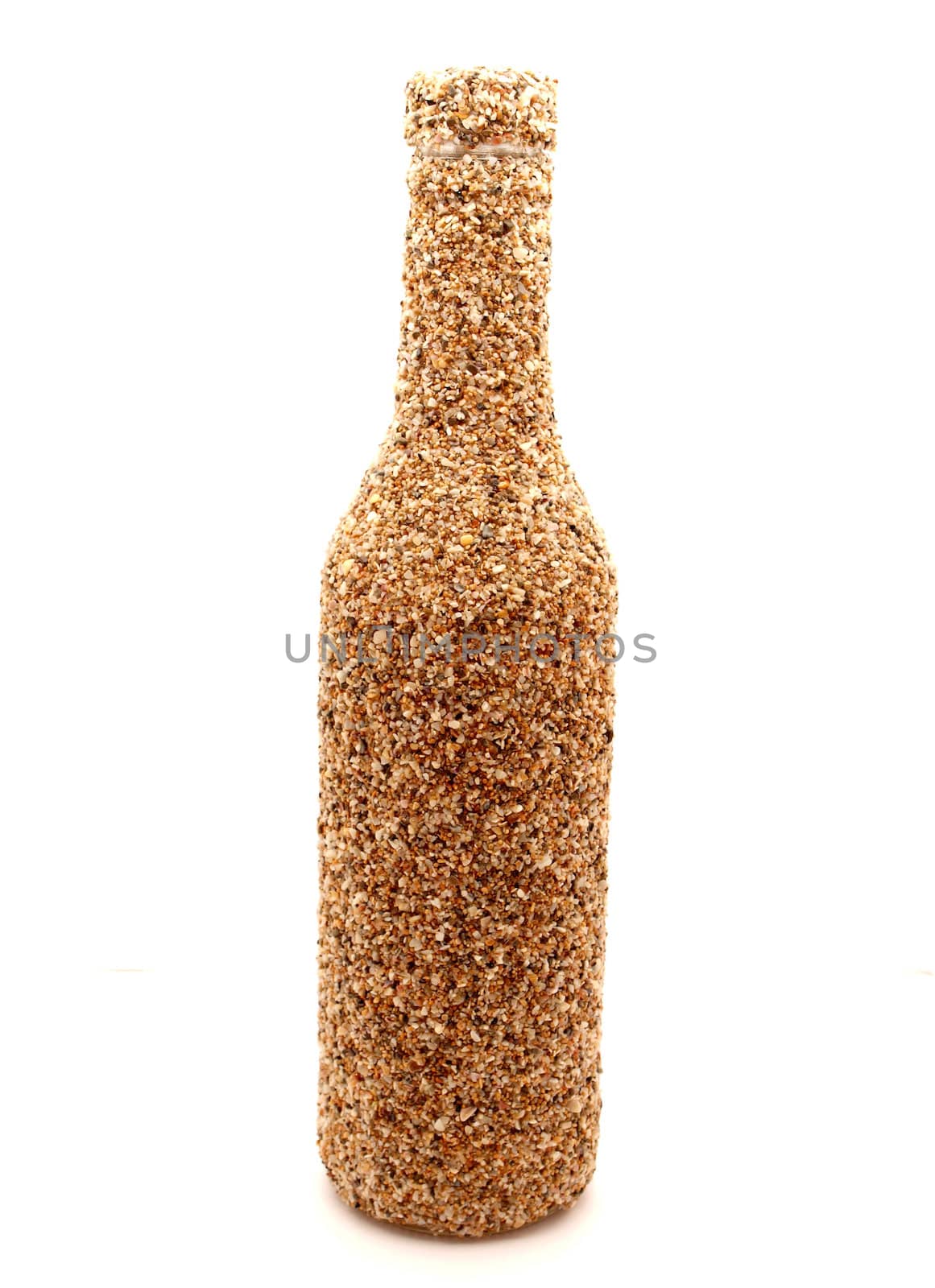 Bottle from sand on a white background