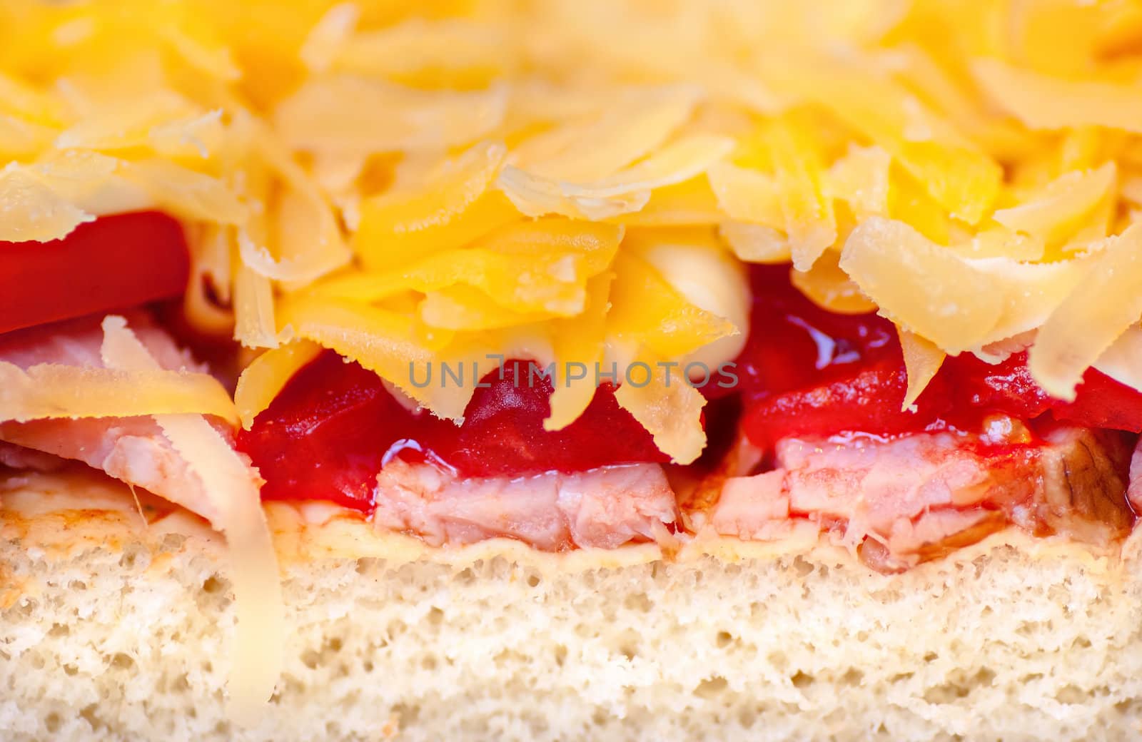 pizza with ham and tomatoes close up