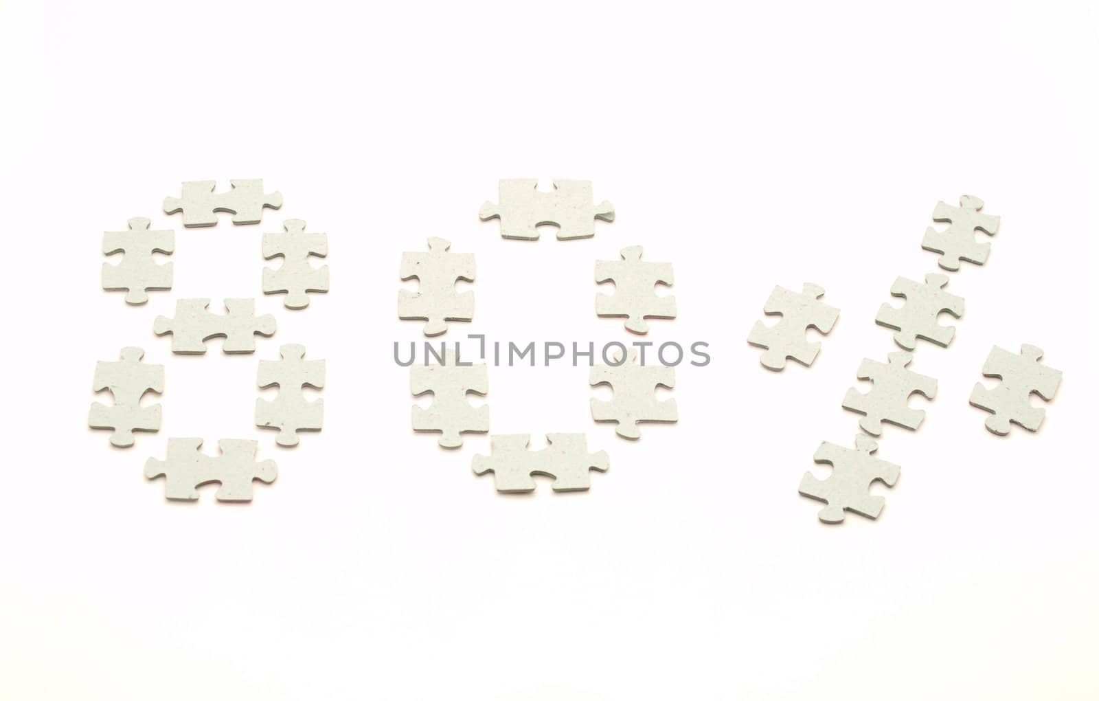 Puzzle pieces on a white background. Eighty percent            