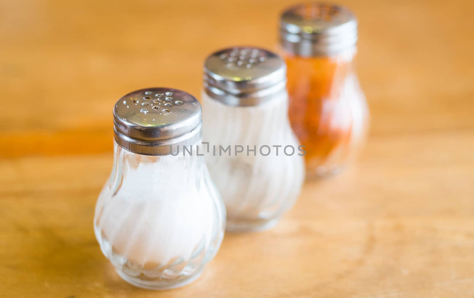 shaker glass bottle of salt and pepper for garnish food