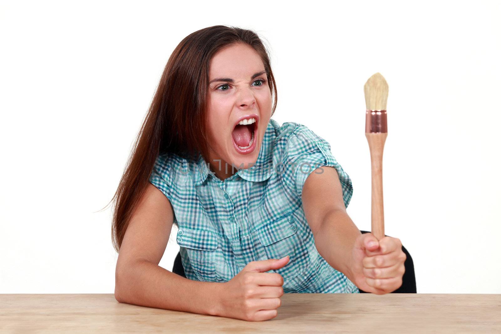 Woman arguing with a paintbrush