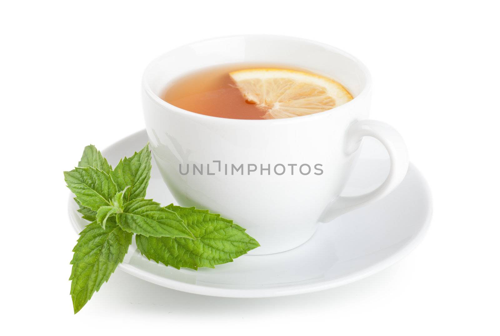 Tea with piece of lemon and mint on a plate over white background