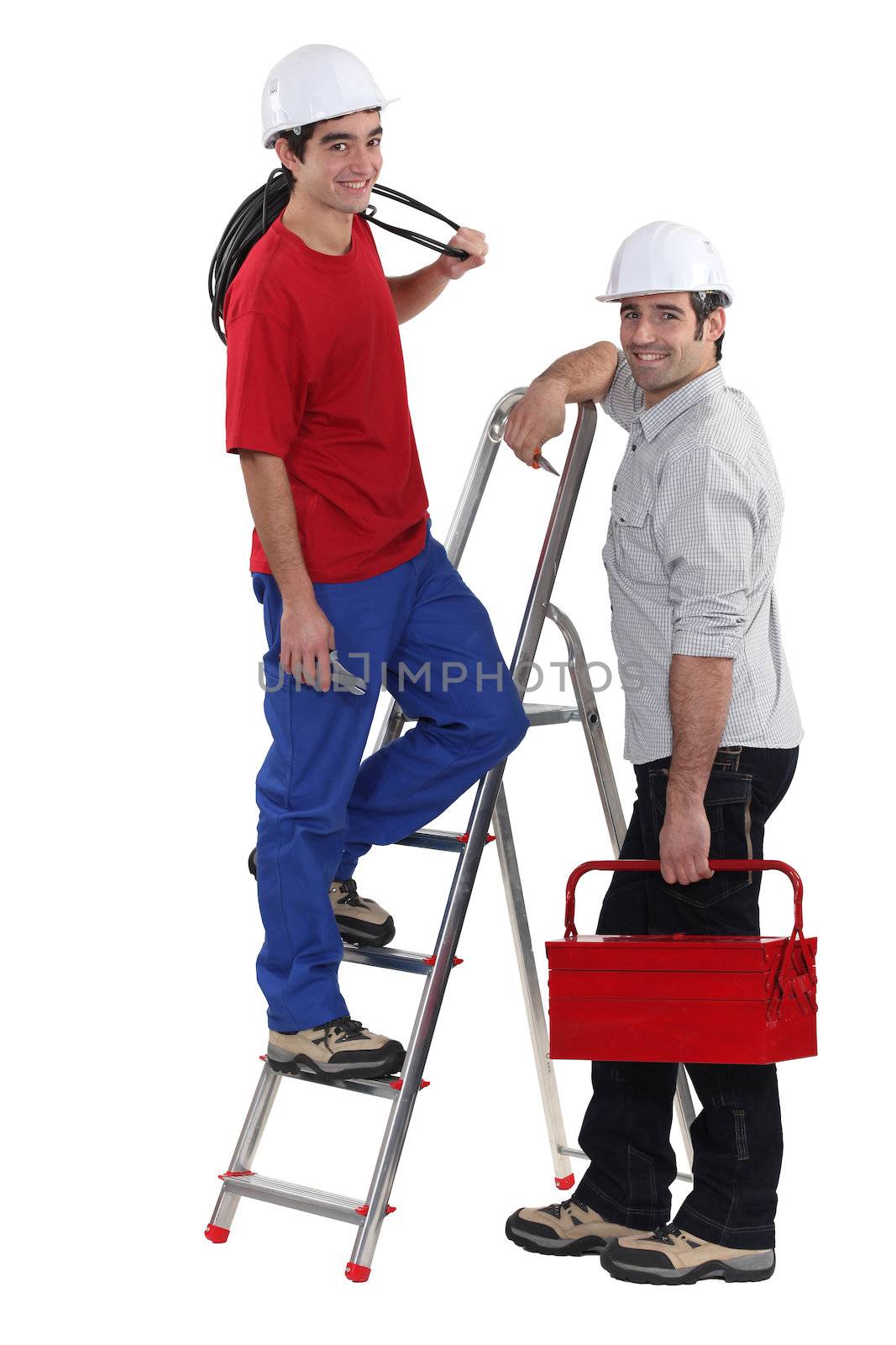 Electrician and young apprentice