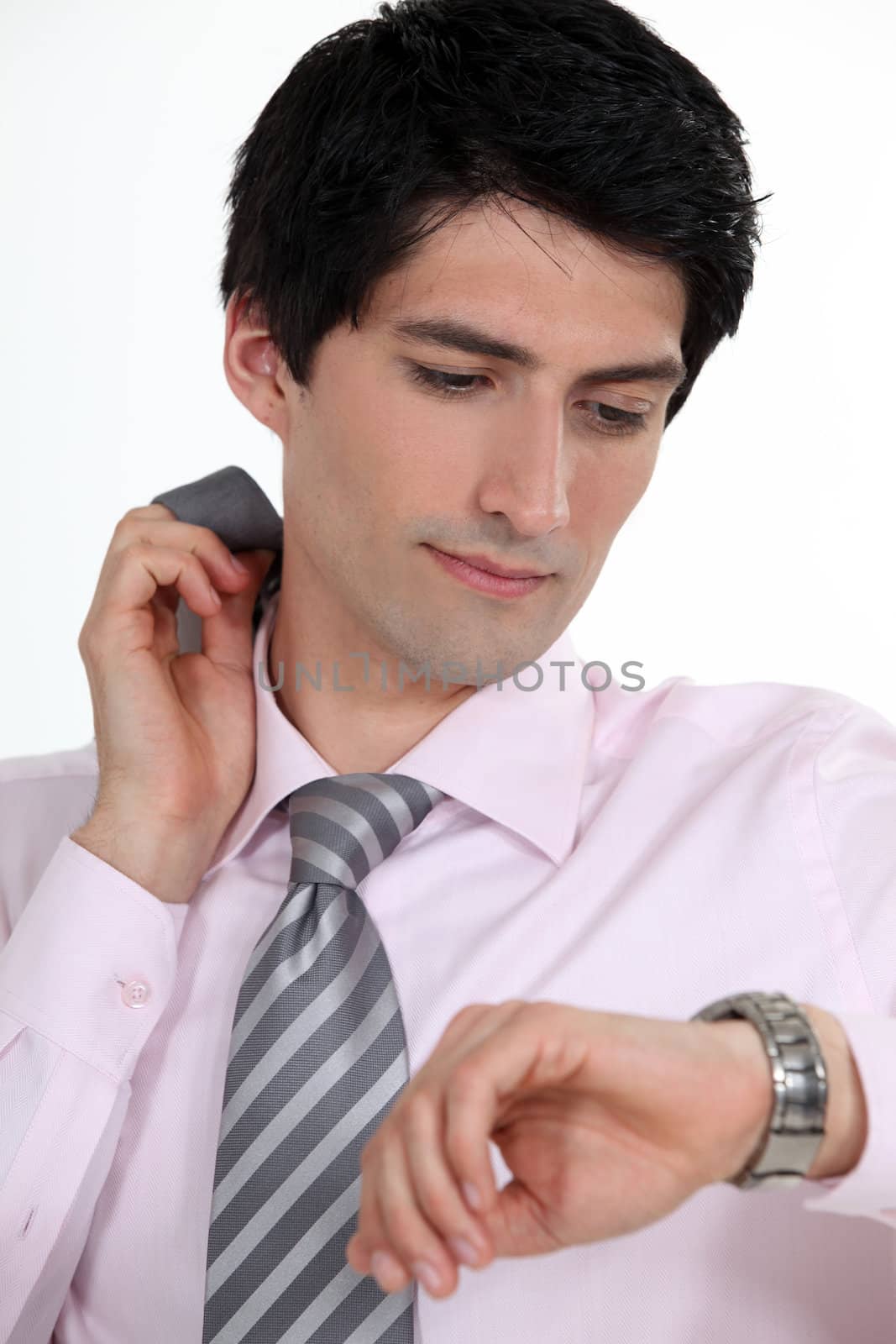 Businessman checking the time by phovoir