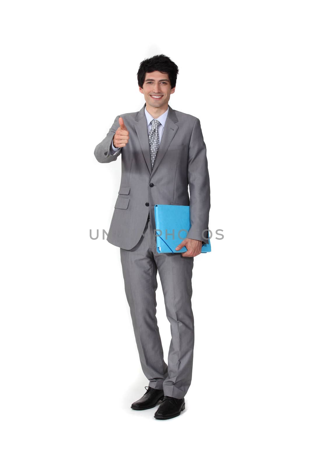 Businessman giving the thumb's up by phovoir