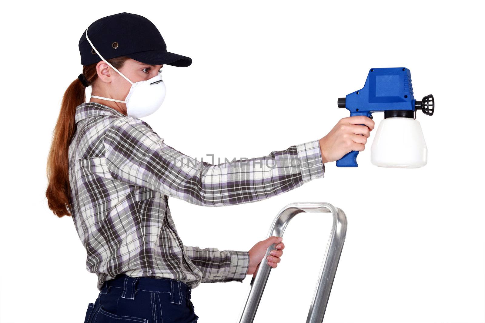 Woman wearing a mask to use a spraygun