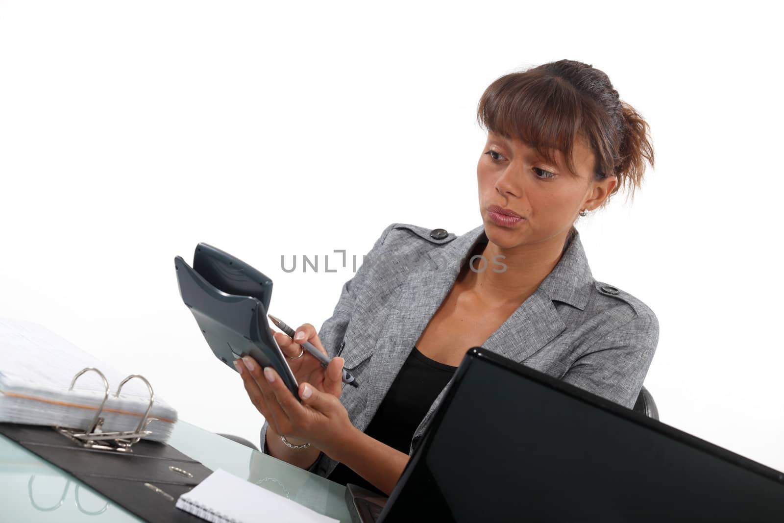 Businesswoman with a calculator by phovoir