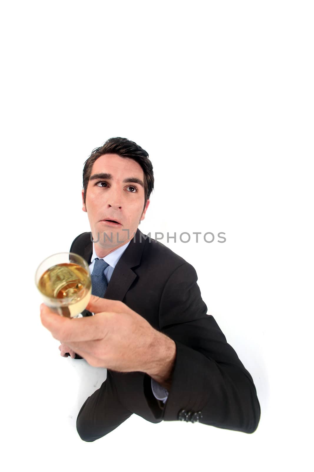 Top view of man with glass in hand by phovoir