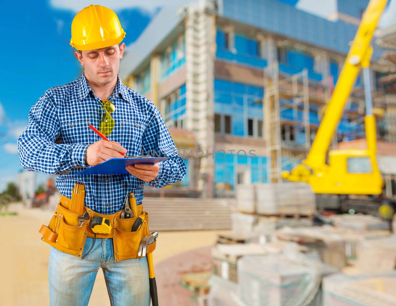 contractor writing in clipboard