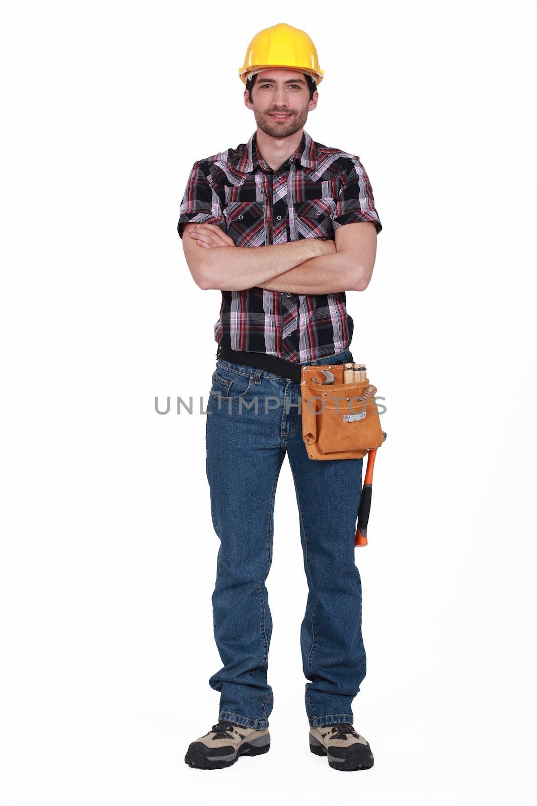 Builder stood with arms crossed