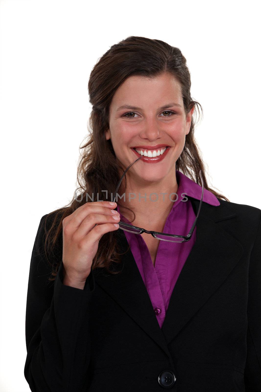 Woman nibbling at the frame of her glasses