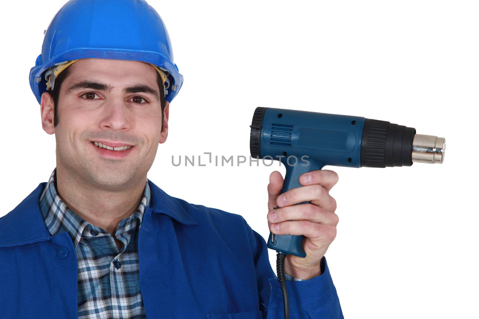 male worker and an electric screwdriver by phovoir