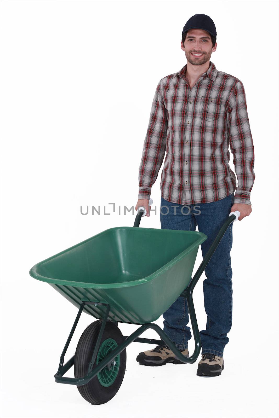 Man with wheelbarrow by phovoir